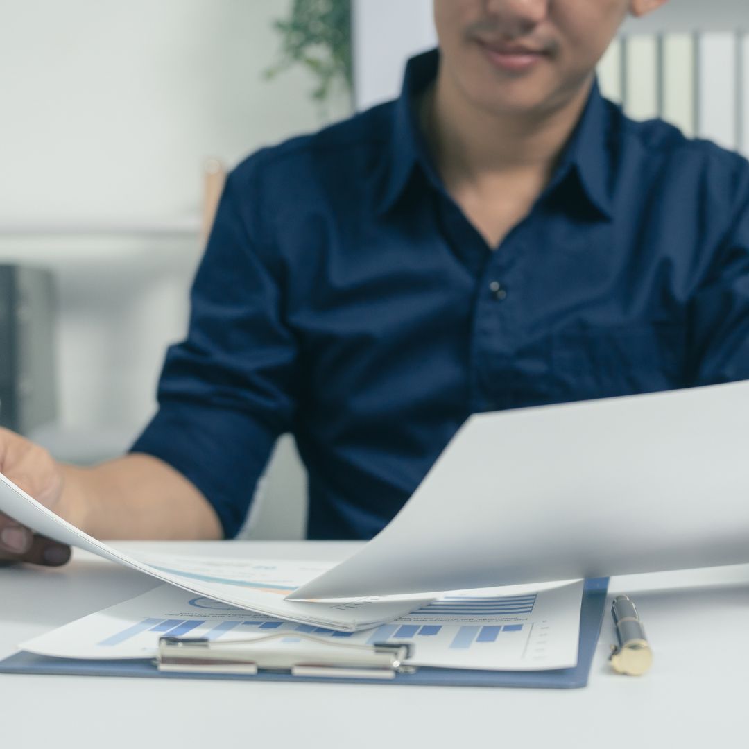 man looking at paperwork