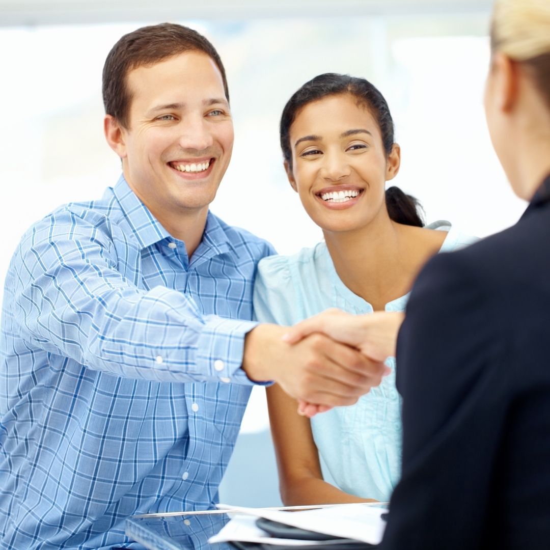 Couple talking to a mortgage lender