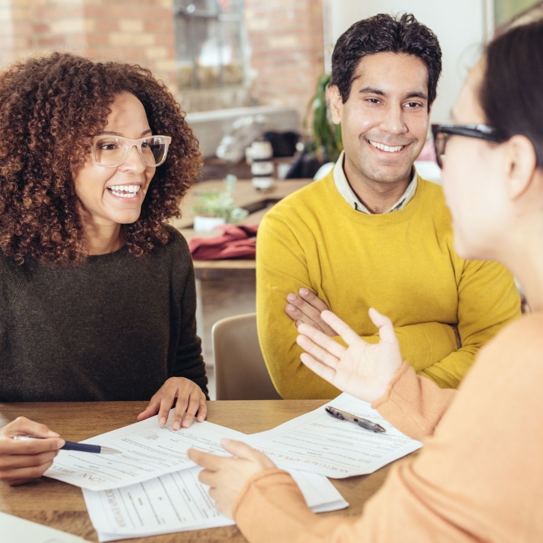 Couple talking with a home loan lender