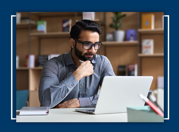 man looking at laptop