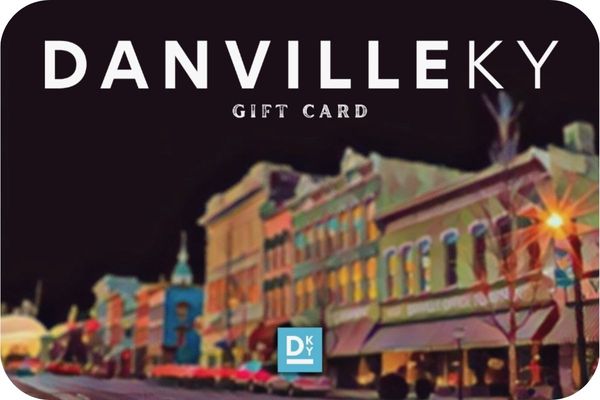 A graphic of a Gift Card featuring a stylized, colorful nighttime painting of a historic downtown street with glowing storefronts and streetlamps.