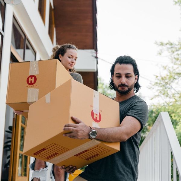 couple carrying first night boxes