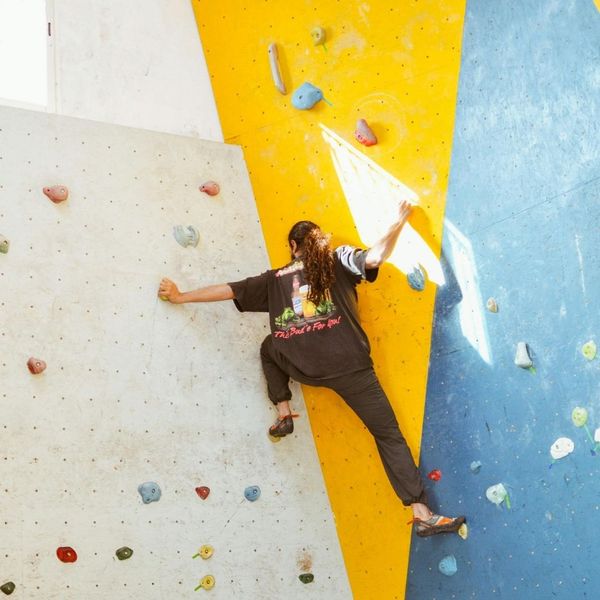 person climbing rock wall