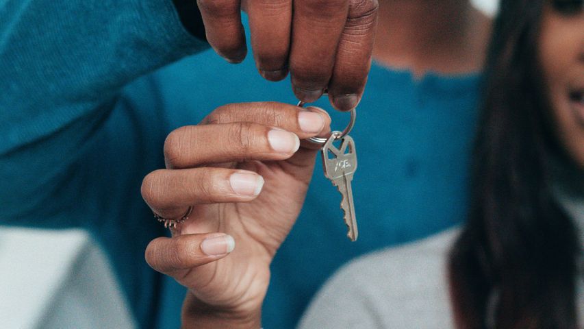 person holding an apartment key