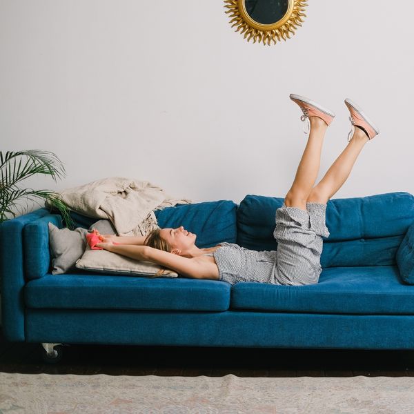 Woman laying on her couch