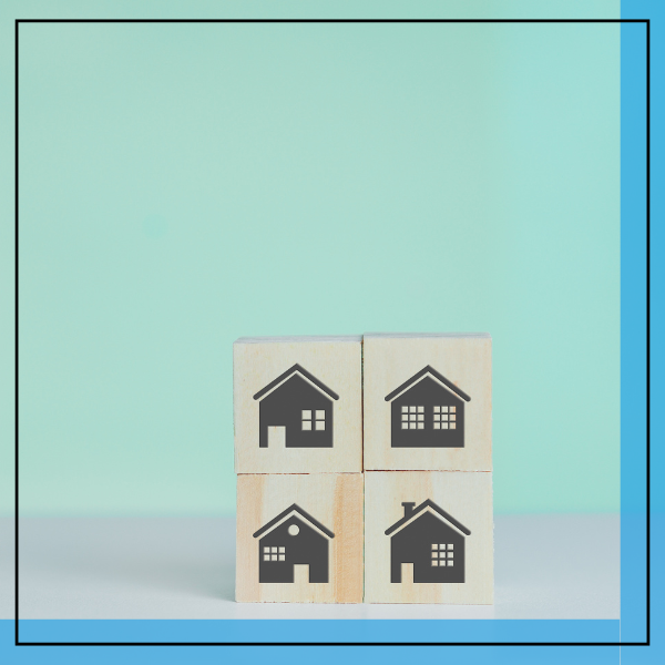 wooden blocks with houses printed on them. 