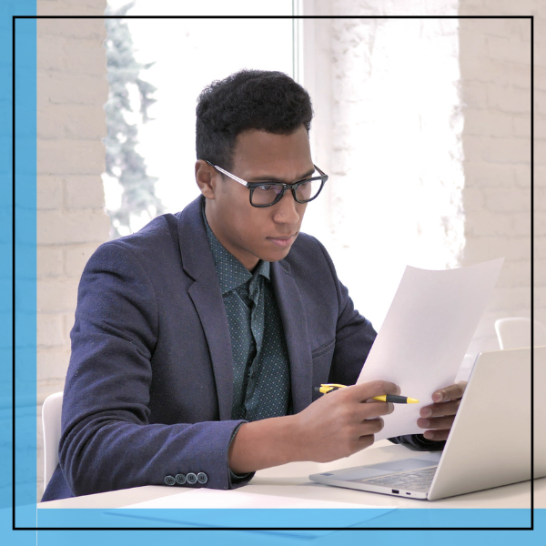 man reading a document. 