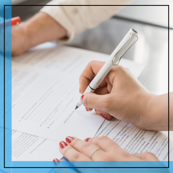 person signing a document. 