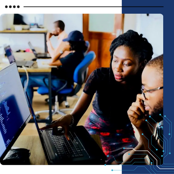 two professionals looking at computer