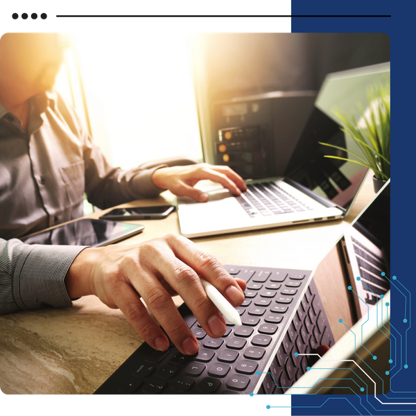 tech professional working on multiple devices