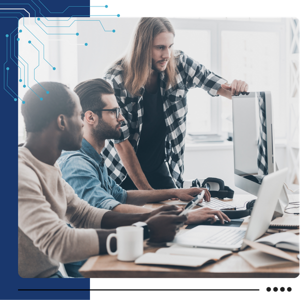 It professionals looking over something on a computer