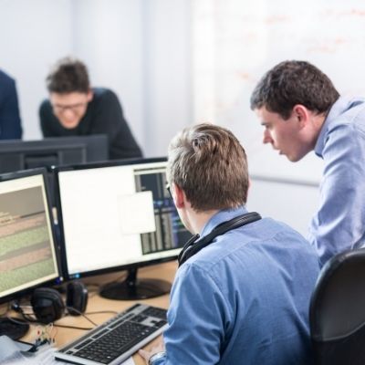 tech professional looking at computer screen tech professional looking at computer screen