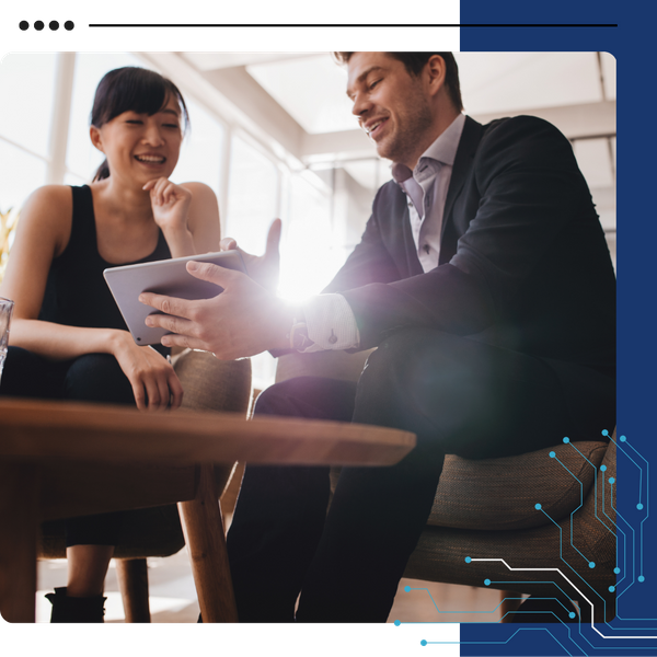 business man showing woman something on tablet