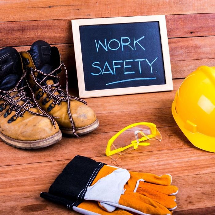 Work safety on chalk board with safety gear around it