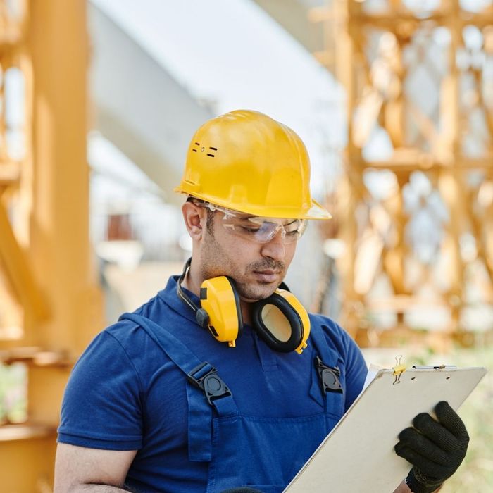 man looking at a safety checklist