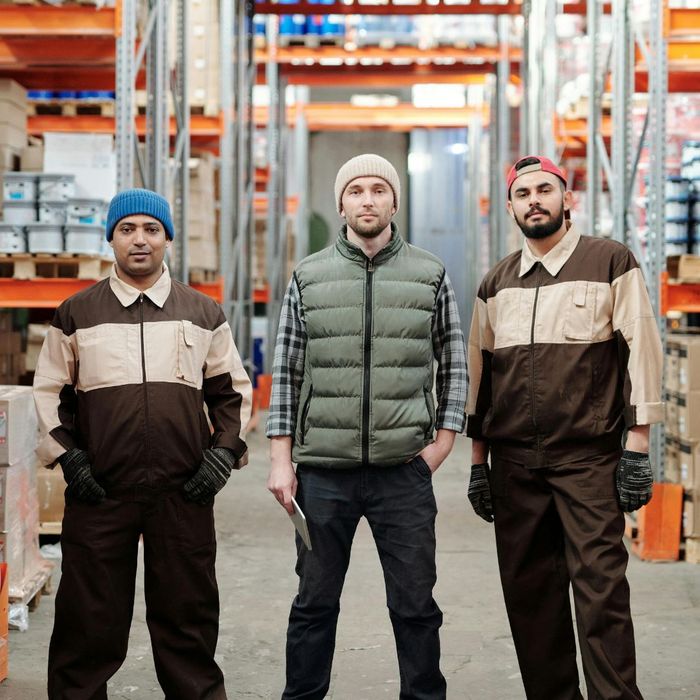 three warehouse employees