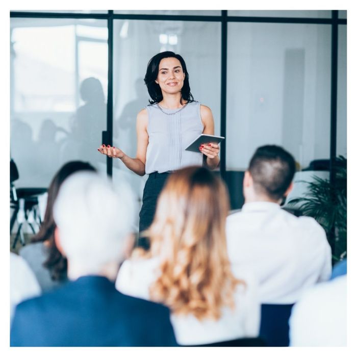 woman leading a seminar