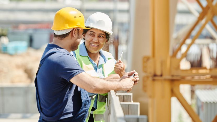 people having a conversation at a job site
