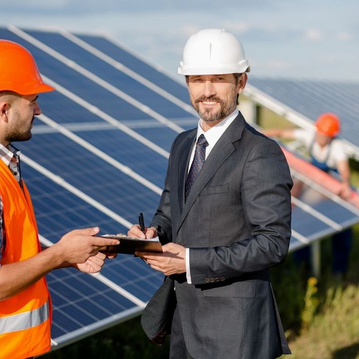 Energy contractor and employees with hard hats