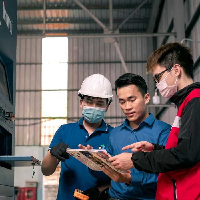 people working in a manufacturing facility