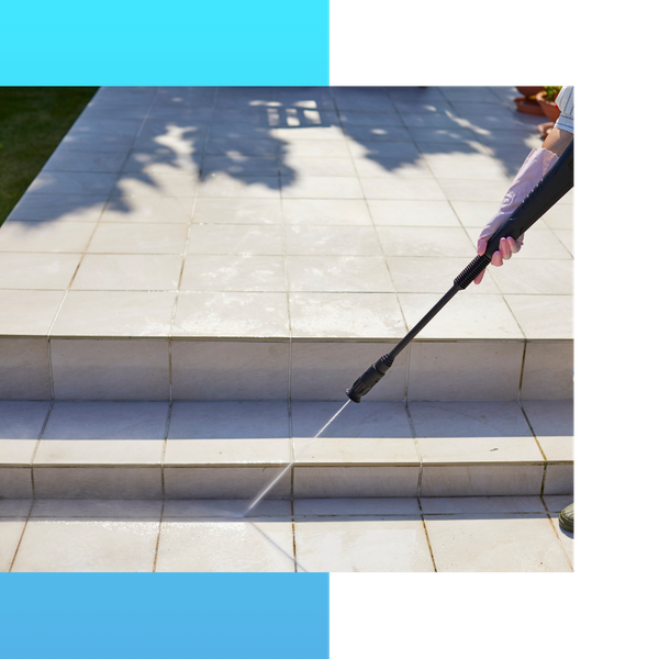 Pressure washing backyard patio