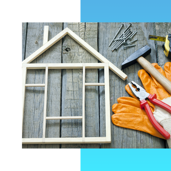 Nails, wood shaped like a home, a hammer, and other common tools
