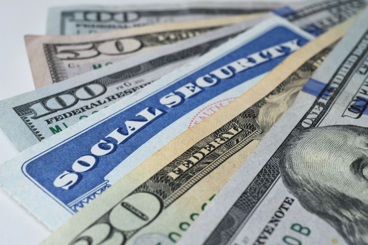 social-security-card-with-cash-money-dollar-bills-2022-11-14-04-20-24-utc.jpg