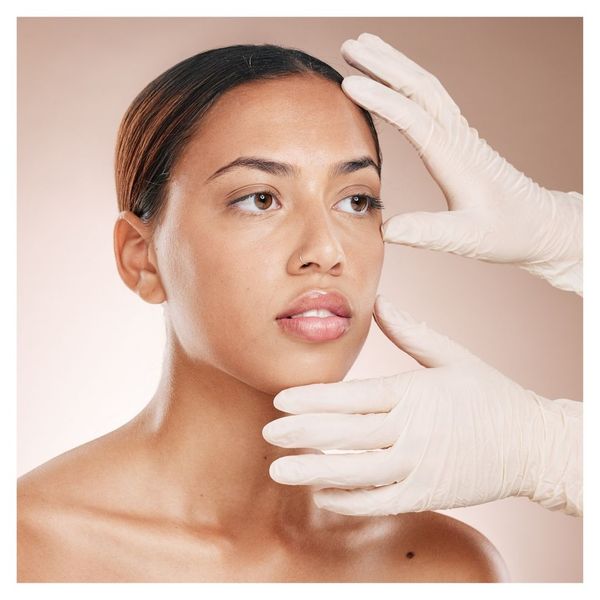 woman getting cosmetic consultation for face