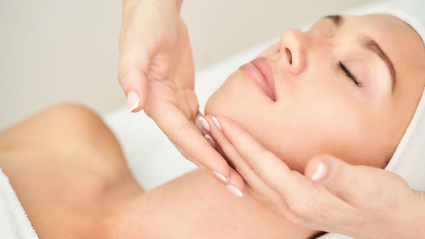 woman receiving facial treatment