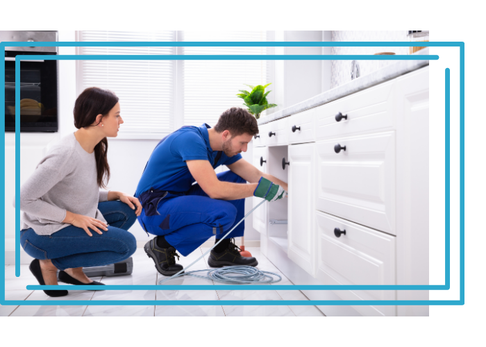 plumber cleaning a drain