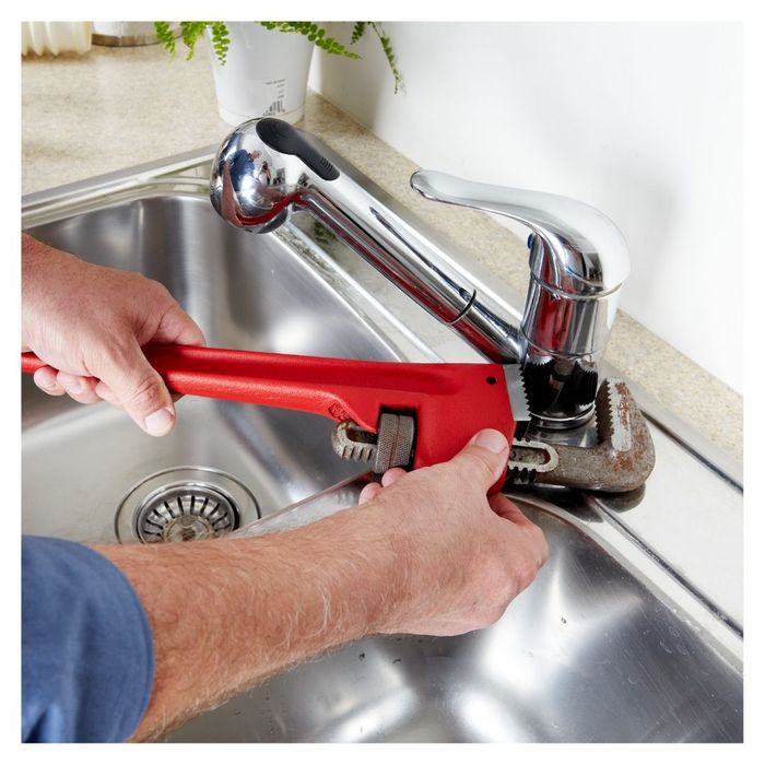 plumber repairing a faucet