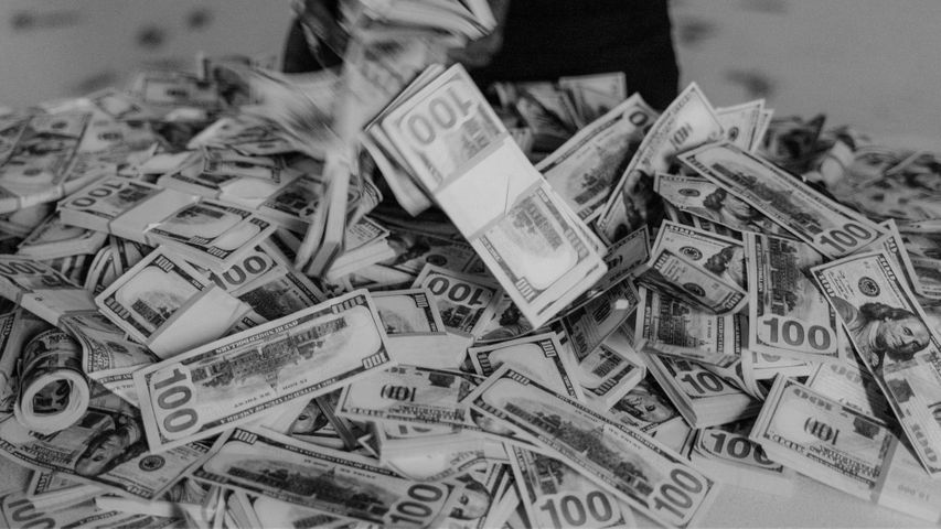 money piled on the floor
