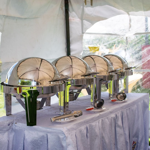 catering food warmers on table with linens Delicious Catering Ideas to Wow Guests at Your Detroit Wedding 1.jpg