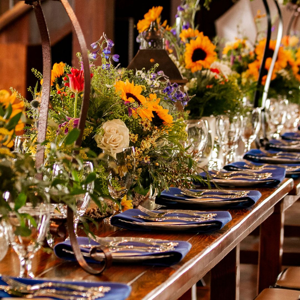 table setting with an elaborate floral arrangement
