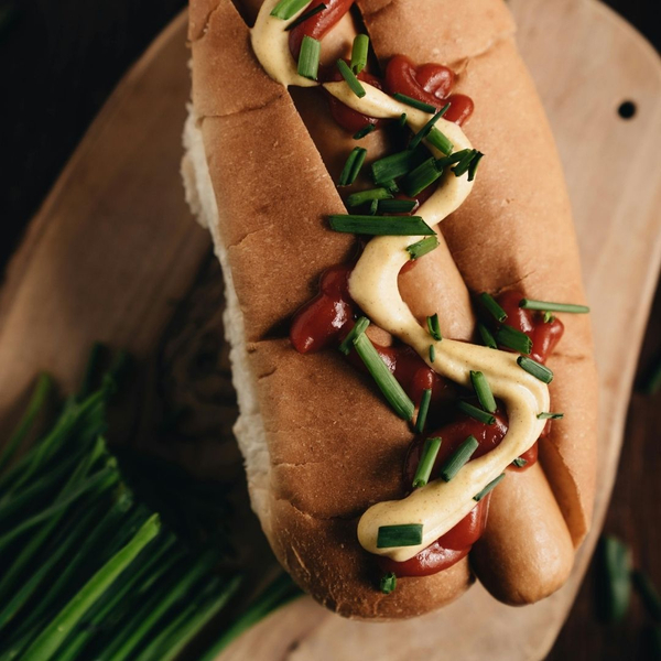 gourmet hot dog with chives and sauces Make Your Next Event Memorable with Detroit's Finest Hot Dog Trucks 2.jpg
