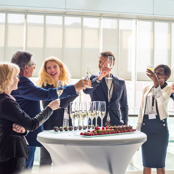 corporate employees raising a glass