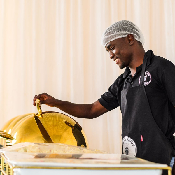 A catering worker serving food