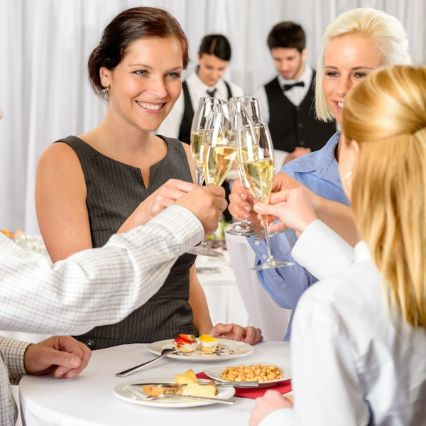 group of people cheersing with glasses of champagne group of people cheersing with glasses of champagne