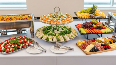  An elegant corporate event buffet with a variety of gourmet dishes.