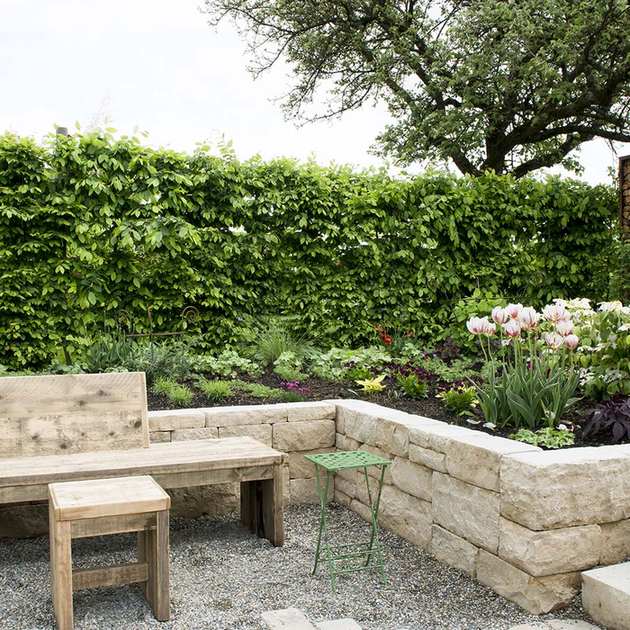 Wooden bench and stone landscaping