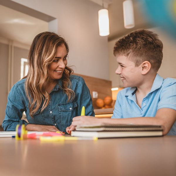 tutor with student and book