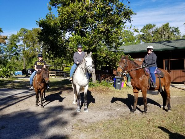 horseback riders looking at camera