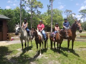 horseback riders looking at camera