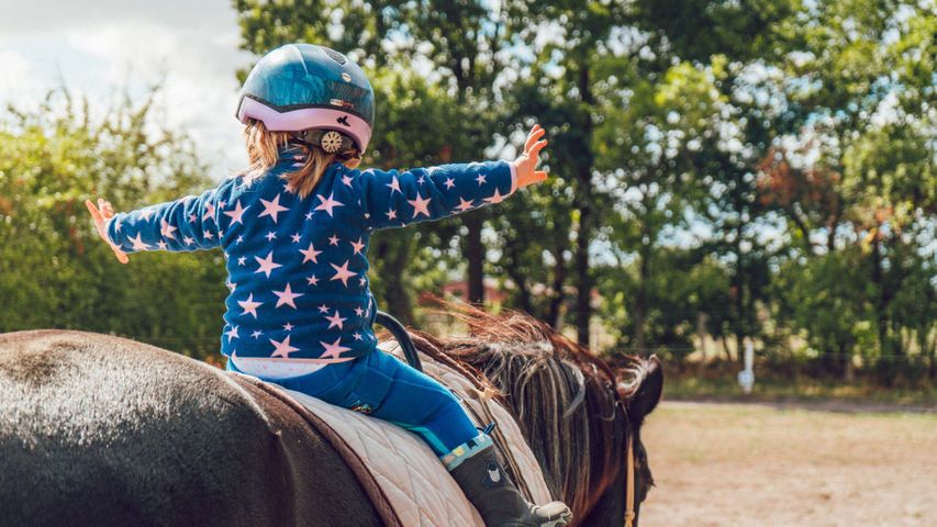 little girl riding horse