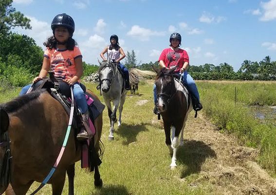 horseback riders looking at camera