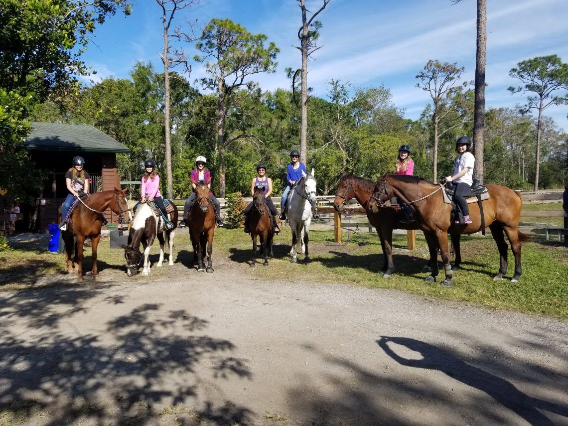 horseback riders looking at camera