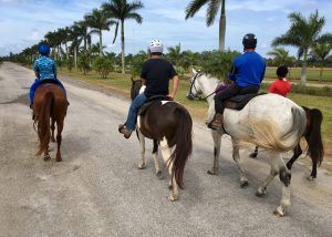 3 people on horseback