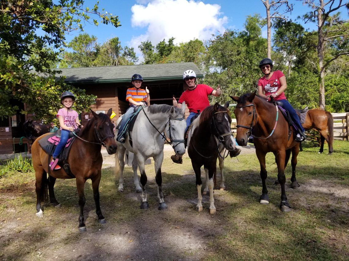 horseback riders looking at camera