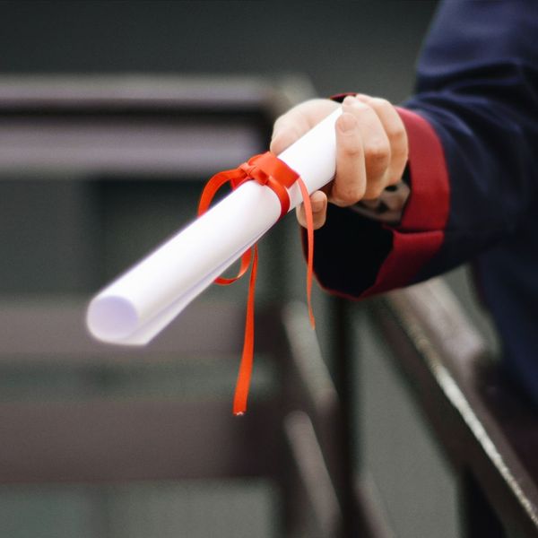 Person holding diploma