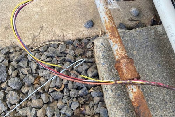 a damaged low-voltage thermostat or control wiring for an HVAC unit.